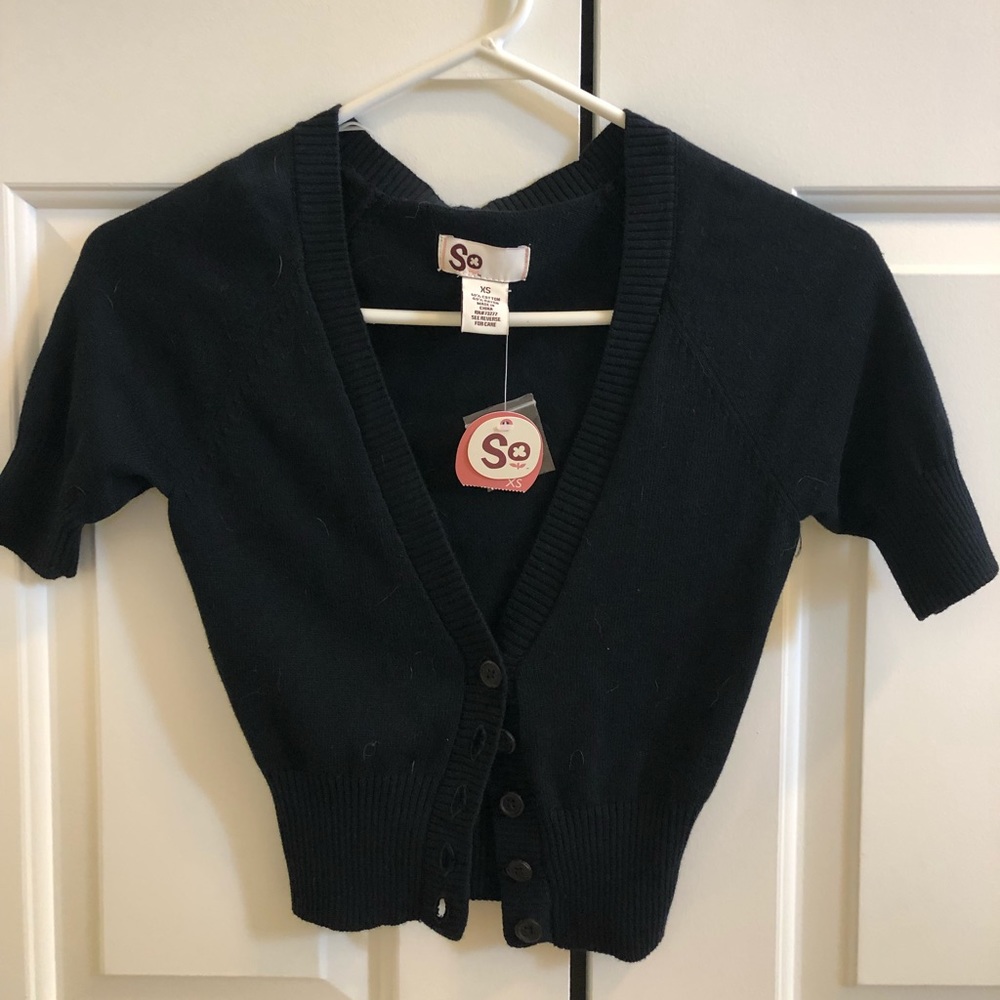 Black jersey cardigan.